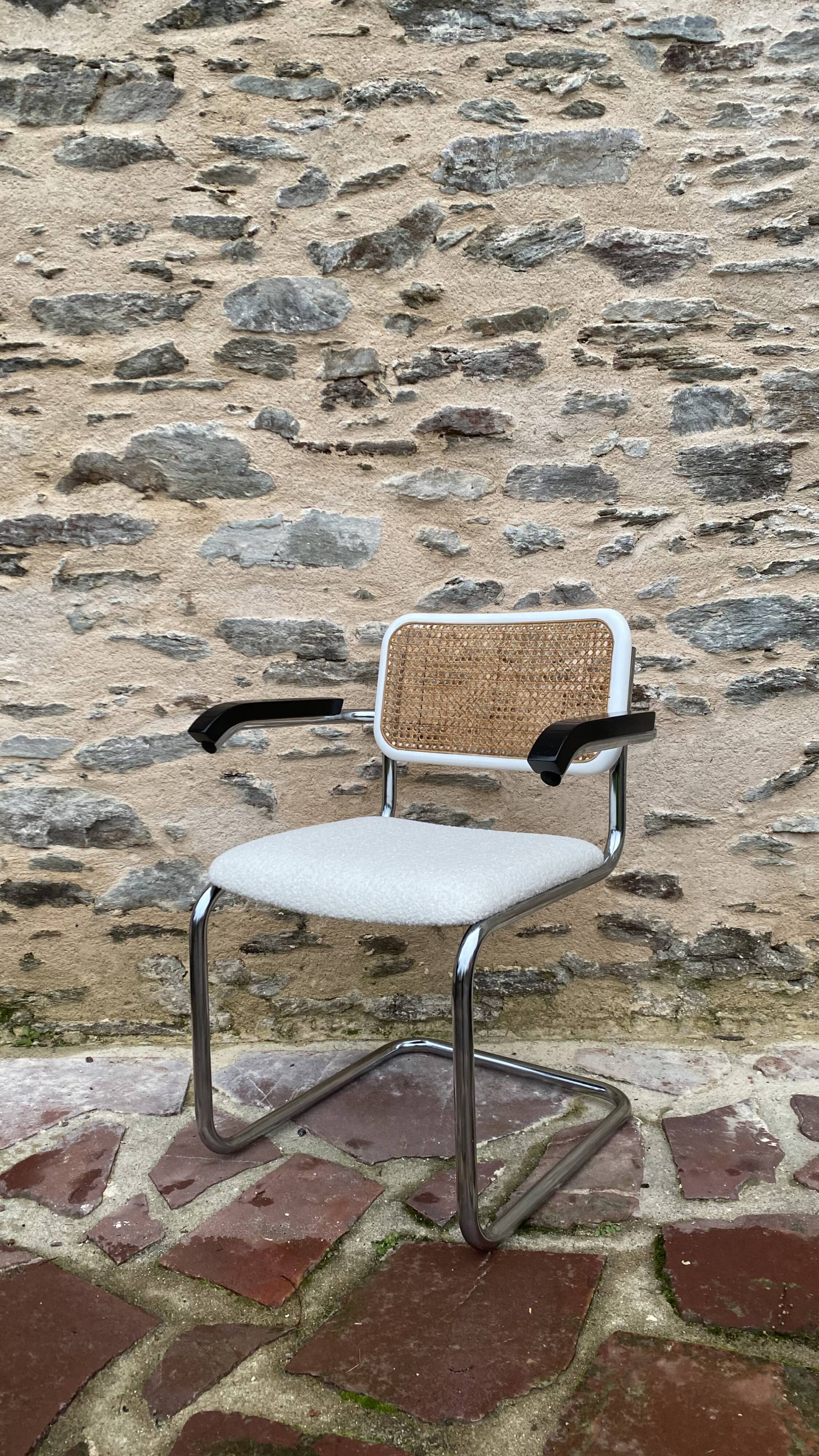 Cantilever armchair in cane and bouclette fabric