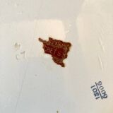 Art Nouveau plate in earthenware with a brass frame