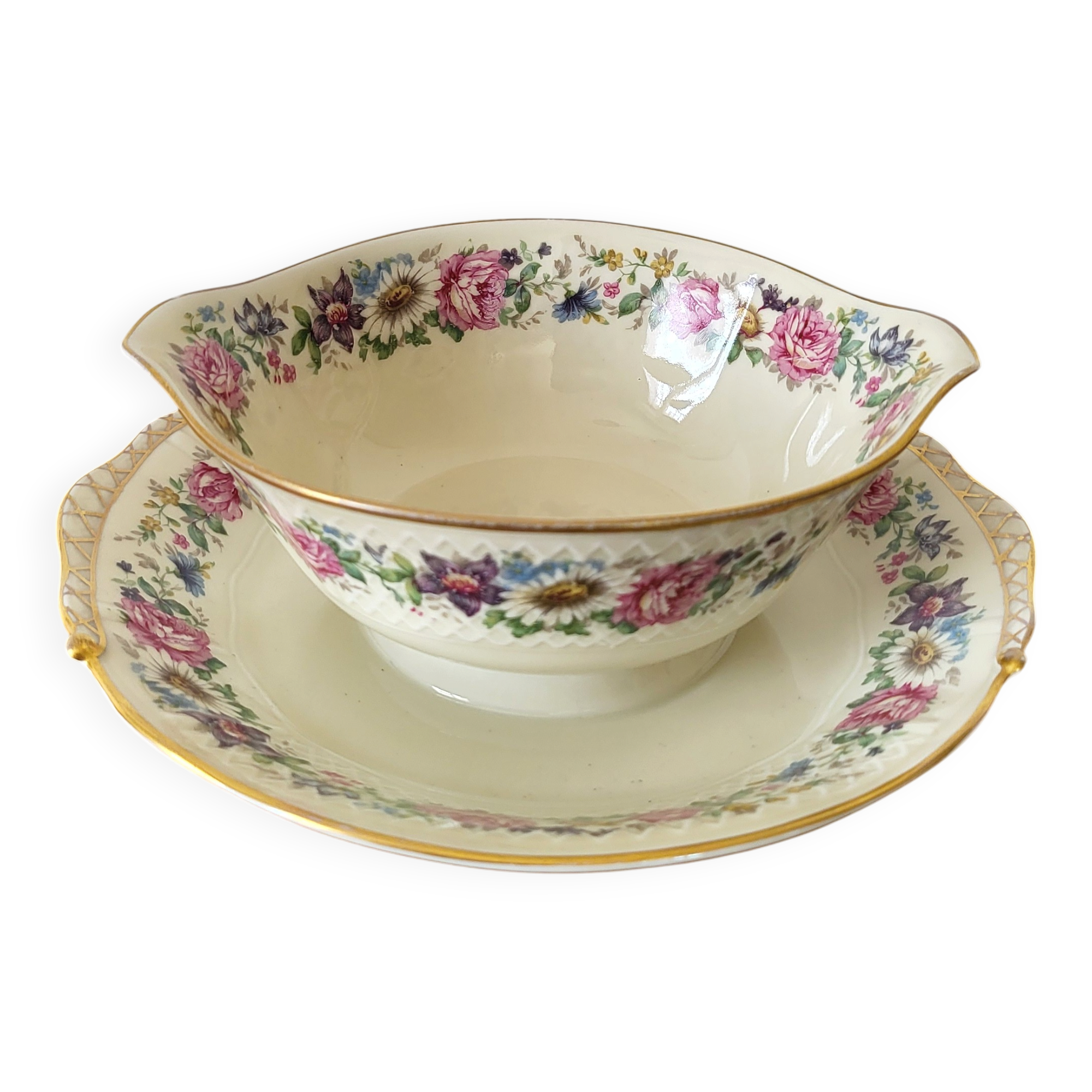 Limoges Bernardaud. Sauce boat in porcelain with floral decorations.