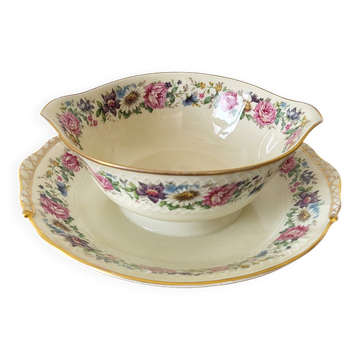 Limoges Bernardaud. Sauce boat in porcelain with floral decorations.