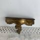 Small baroque-style console in gilded wood.