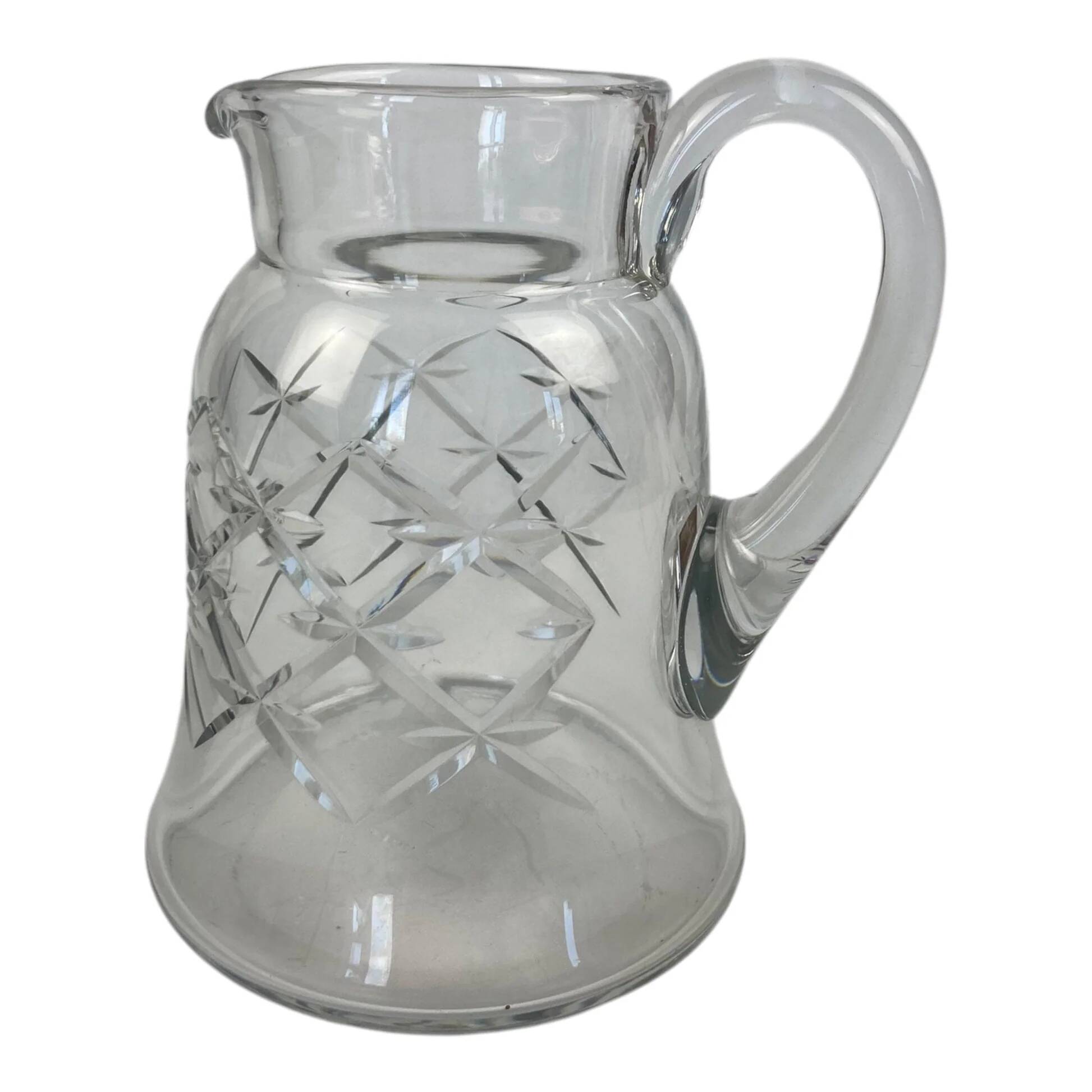 Antique Baccarat water jug in cut crystal with bevels.