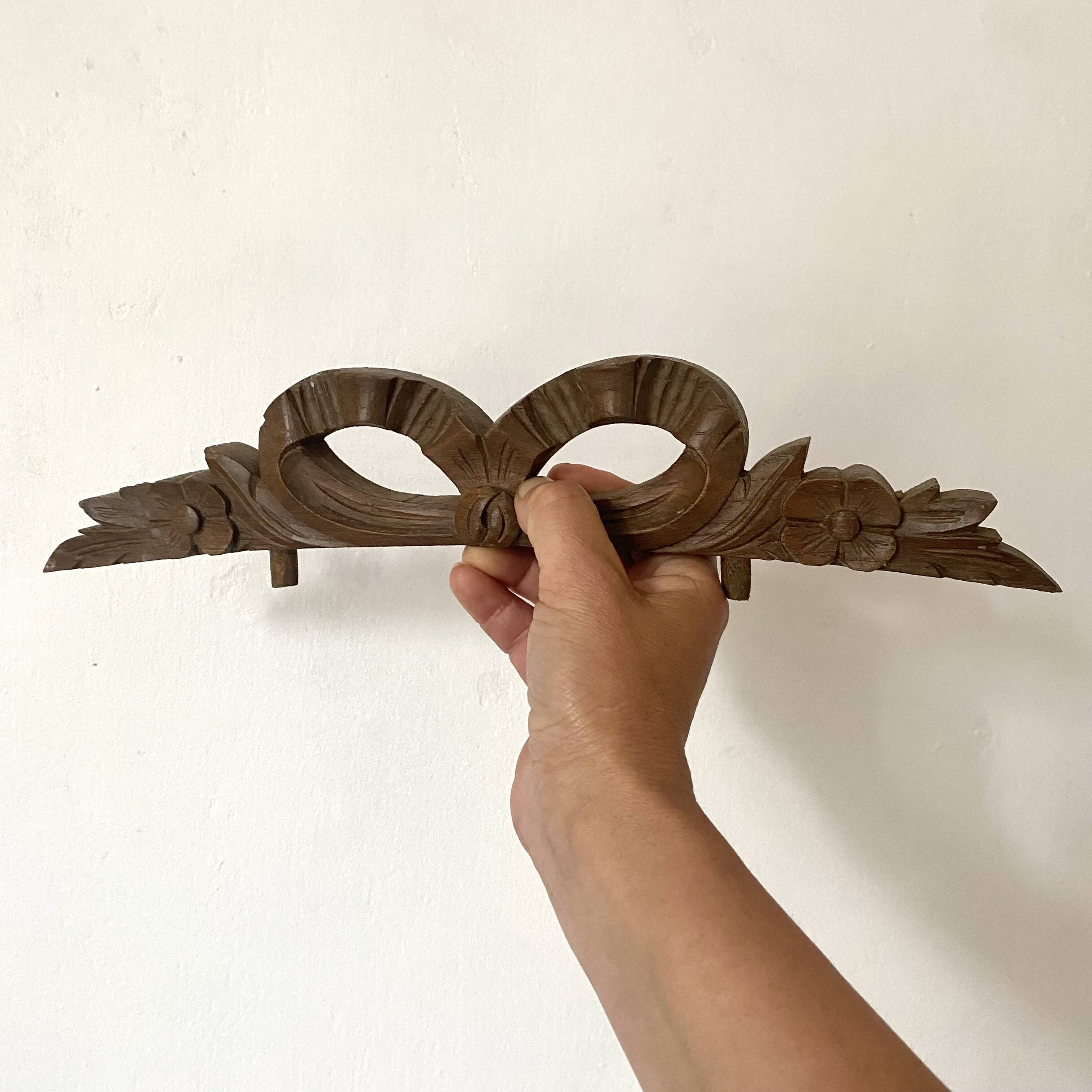 Antique carved wooden ribbon pediment