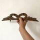 Antique carved wooden ribbon pediment