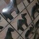 Black metal firewall decorated with animals
