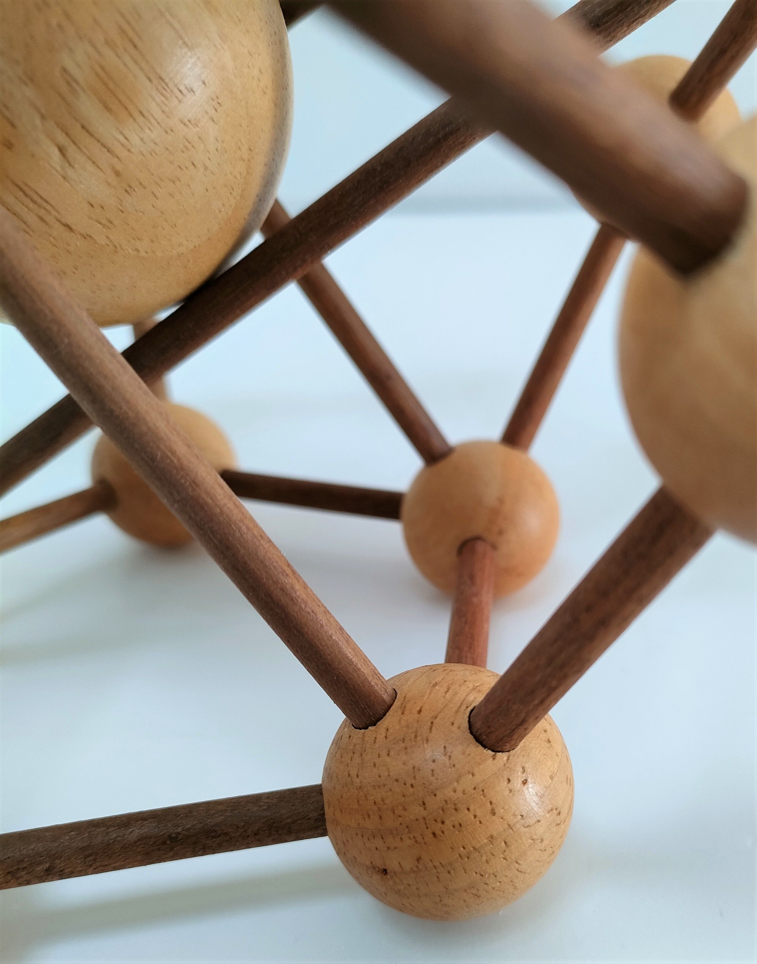 Sculptural modeling of a solid wood atom contemporary design
