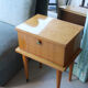 Modernist bedside table from the 1950s with compass legs.