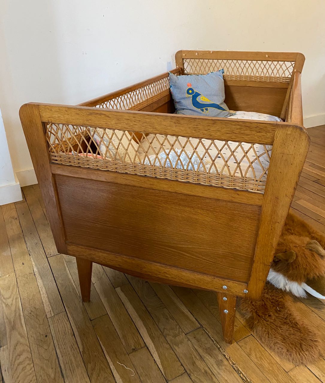 Wooden and wicker baby bed
