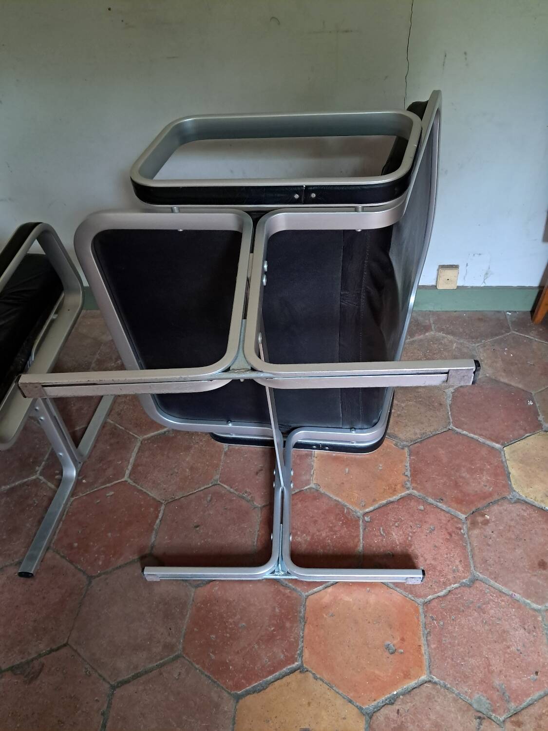 Pair of leather and aluminum armchairs
