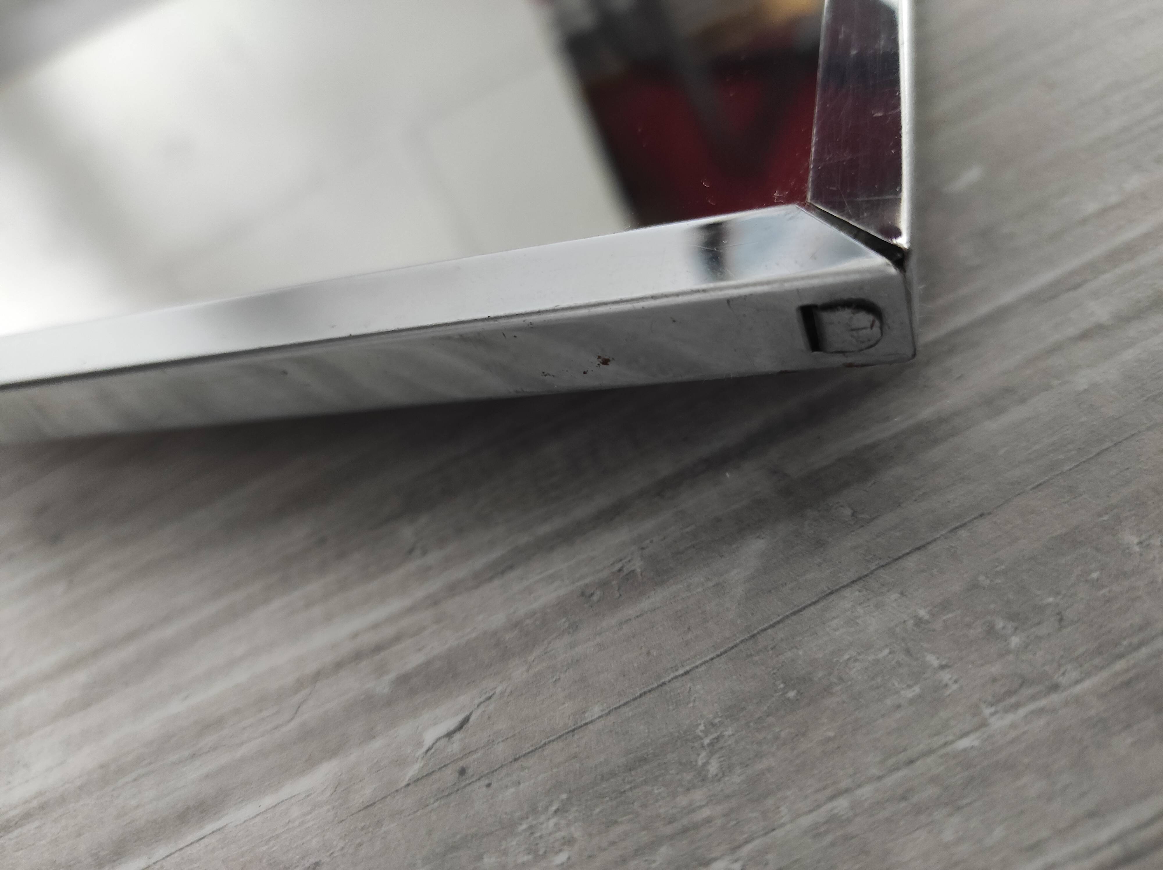 Vintage mirror with silver metal frame to hang