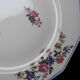 4 Bernardaud Limoges porcelain dinner plates with floral decoration, 1920s-1950s