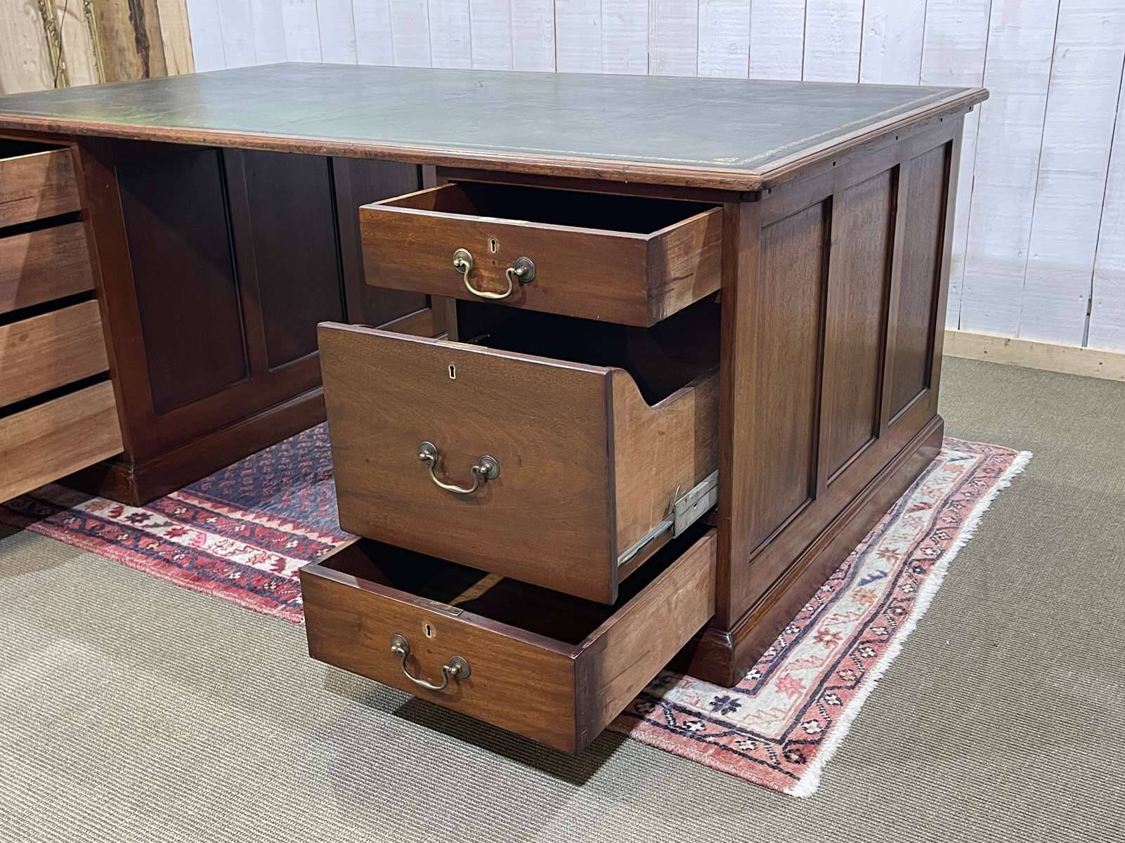 Large English flat desk in mahogany with leather top, early 20th century