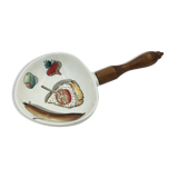 Ceramic aperitif dish and wooden handle.