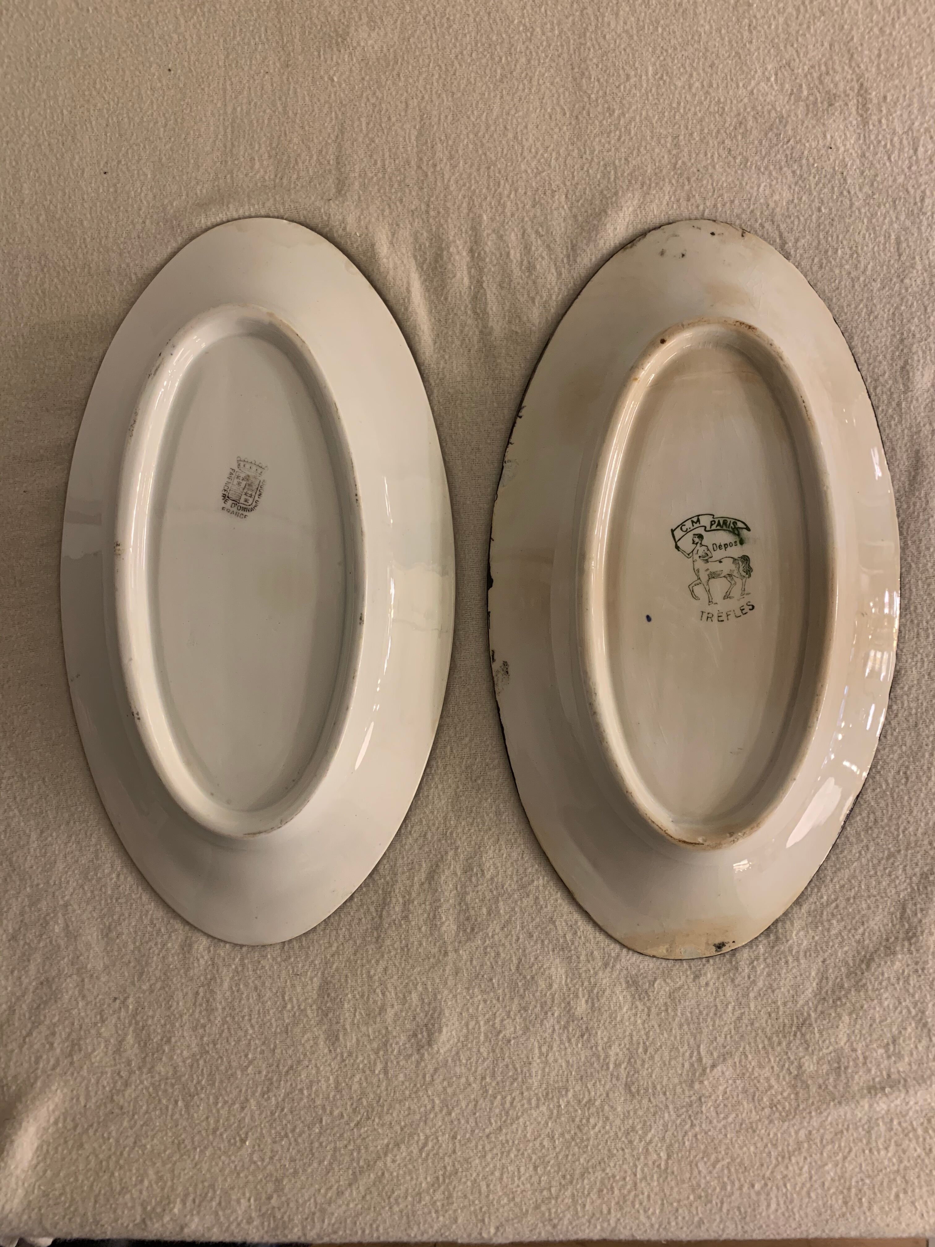 Pair of floral ravines in ancient earthenware Onnaing and CM Paris model Clovers