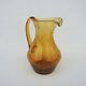 Vintage amber bubble glass carafe in Biot style.