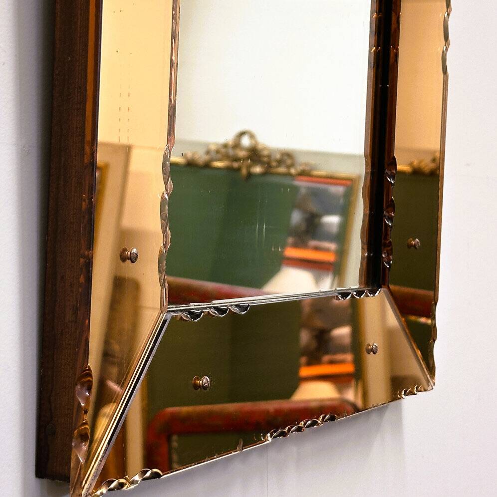 Striking French amber-coloured mirror with sculpted edge details, 1940s