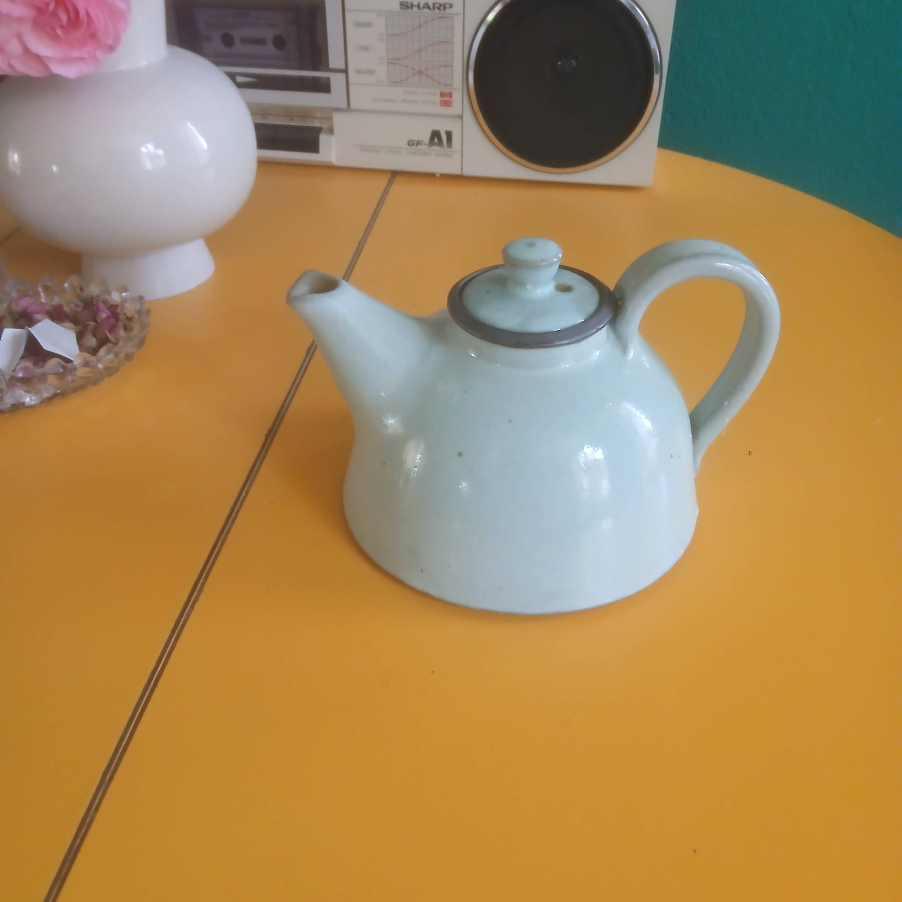 Vintage artisanal style glazed pottery teapot
