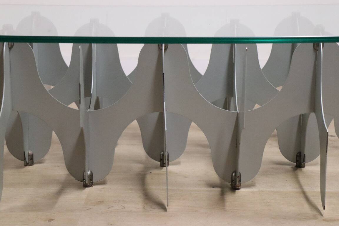 Minimalist sculptural coffee table in metal and glass