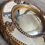 Antique domed witch's eye mirror in gilded wood