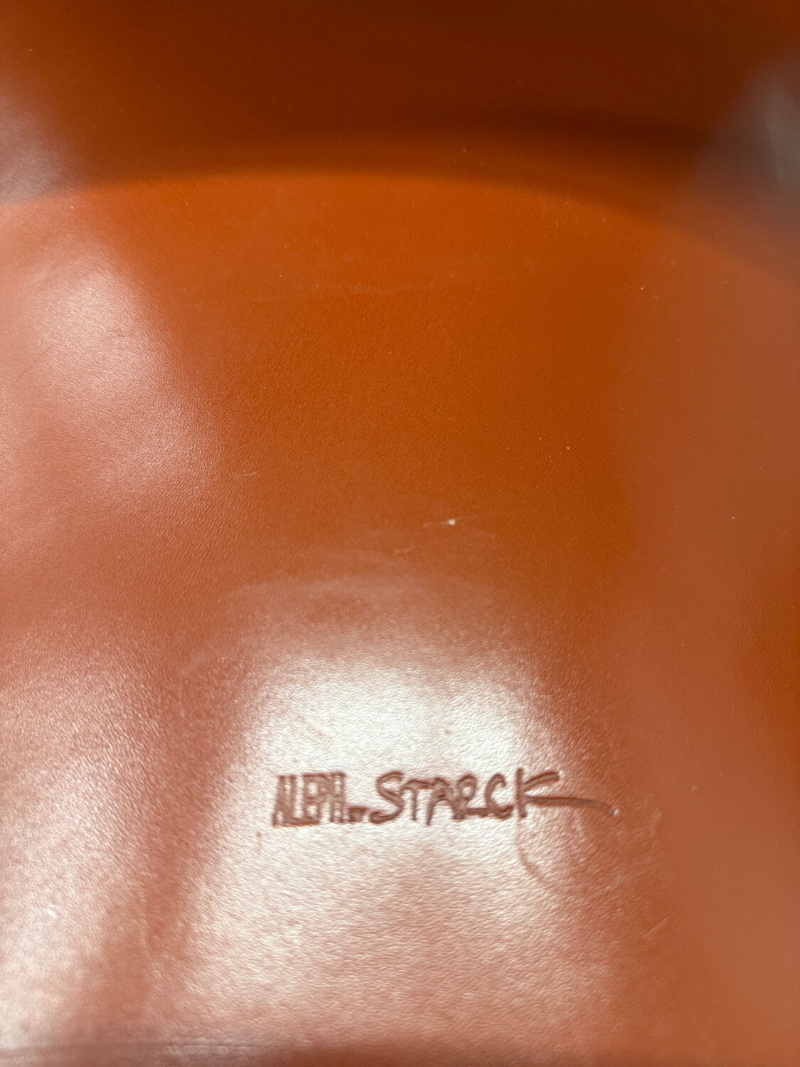 Red leather armchair in modern Italian style, signed Philippe Starck, 1980s.