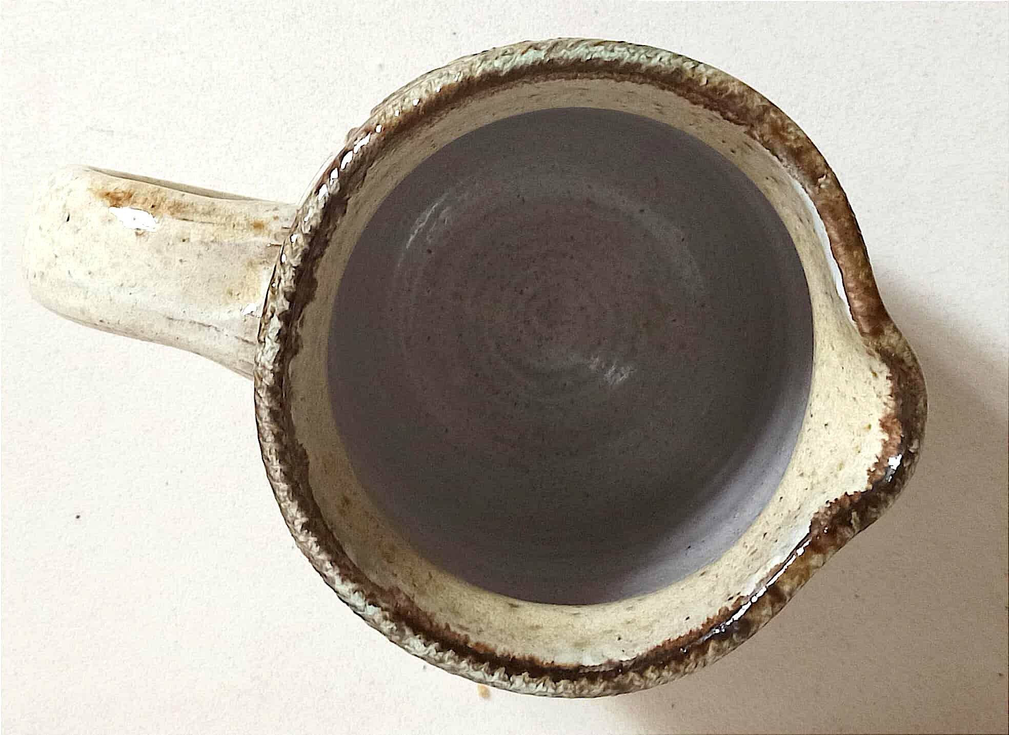 Stoneware pitcher stamped Giraud. Height 18.5 cm