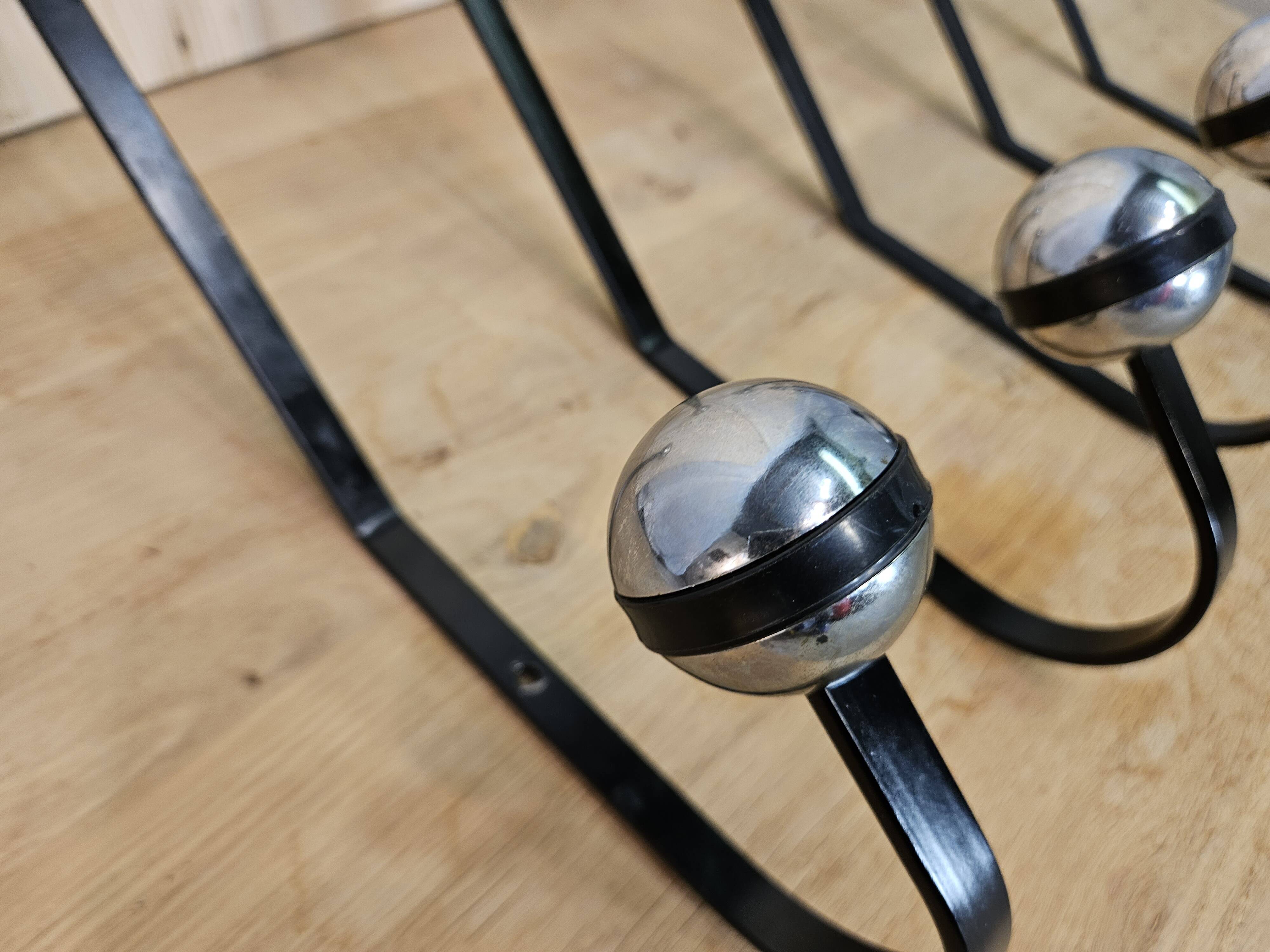 5 black and silver coat hooks from the 60s