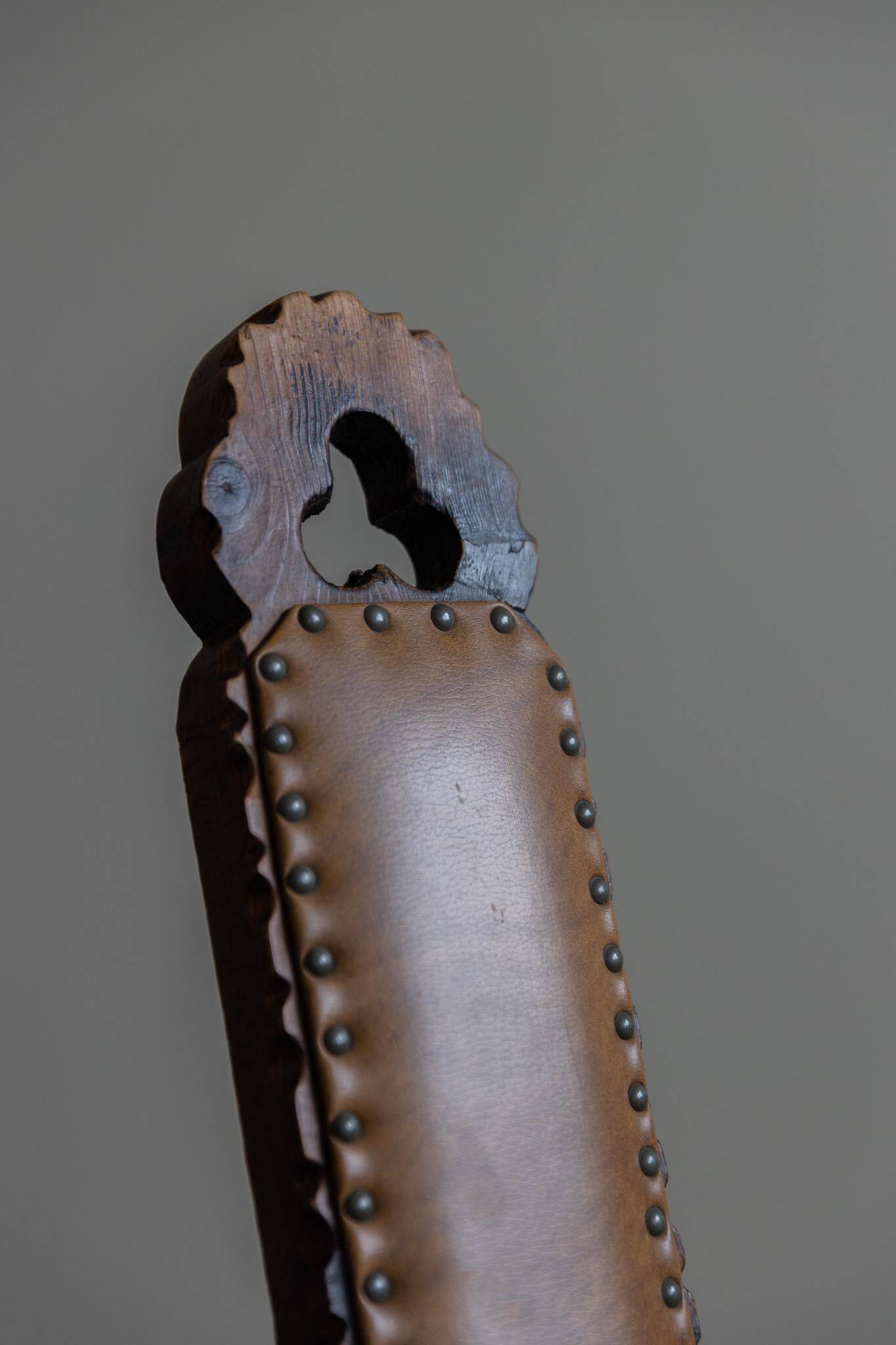 Carved wooden tripod chair with leather seat, Wabi Sabi, early 20th century.