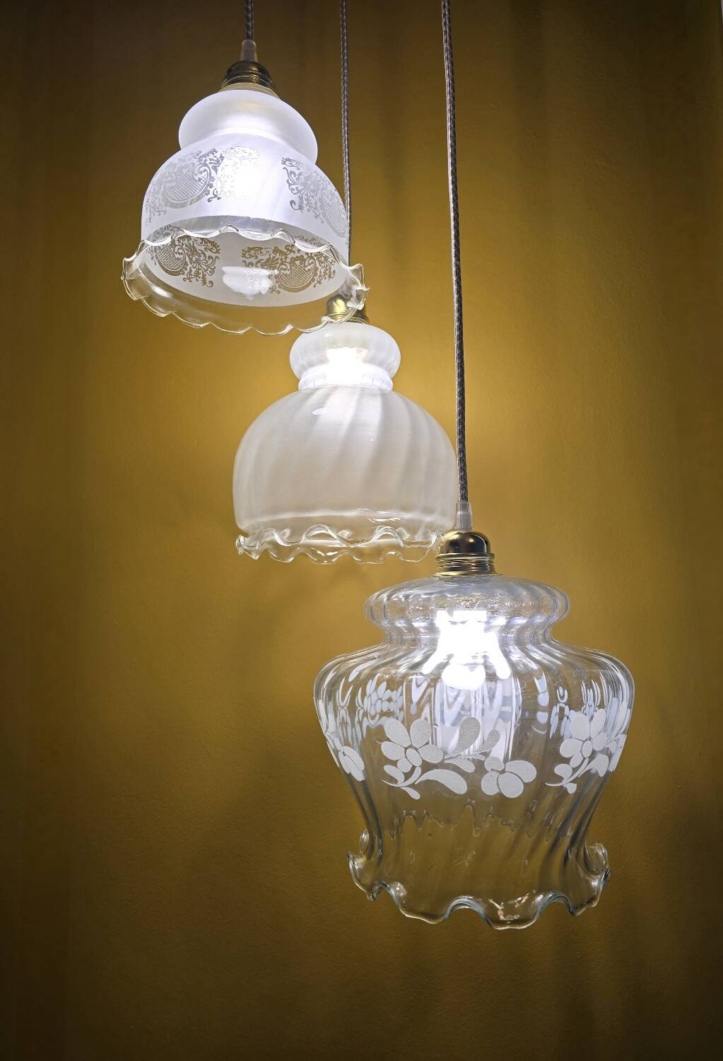 Original suspension of three vintage transparent glass globes.