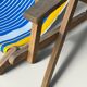 Vintage deck chair with blue and yellow striped fabric, original patina.