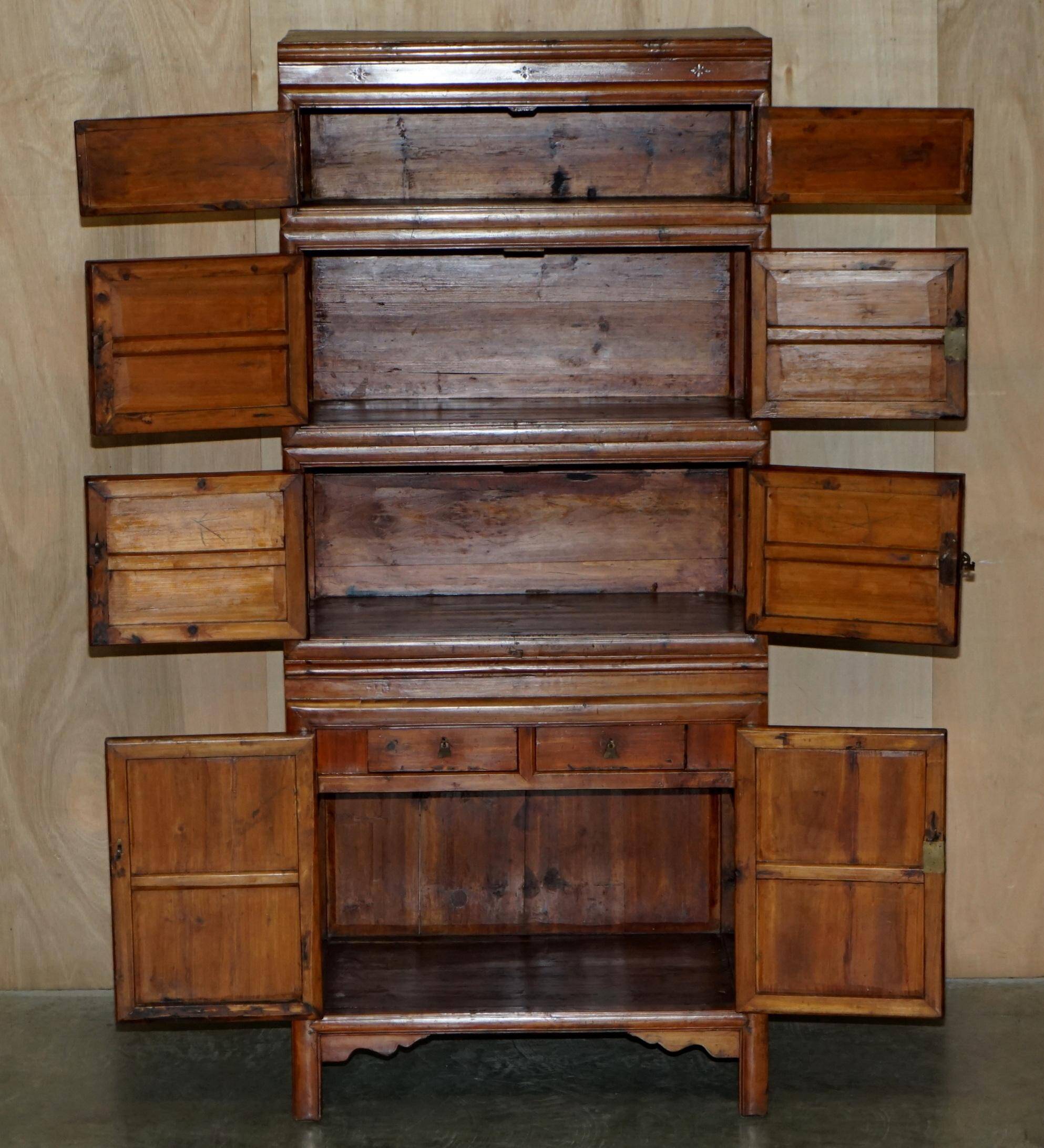 Antique Chinese armoire hand-carved around 1880 with country-style handles.