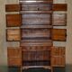 Antique Chinese armoire hand-carved around 1880 with country-style handles.