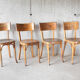 Suite de 4 chaises de bistrot Baumann 1950