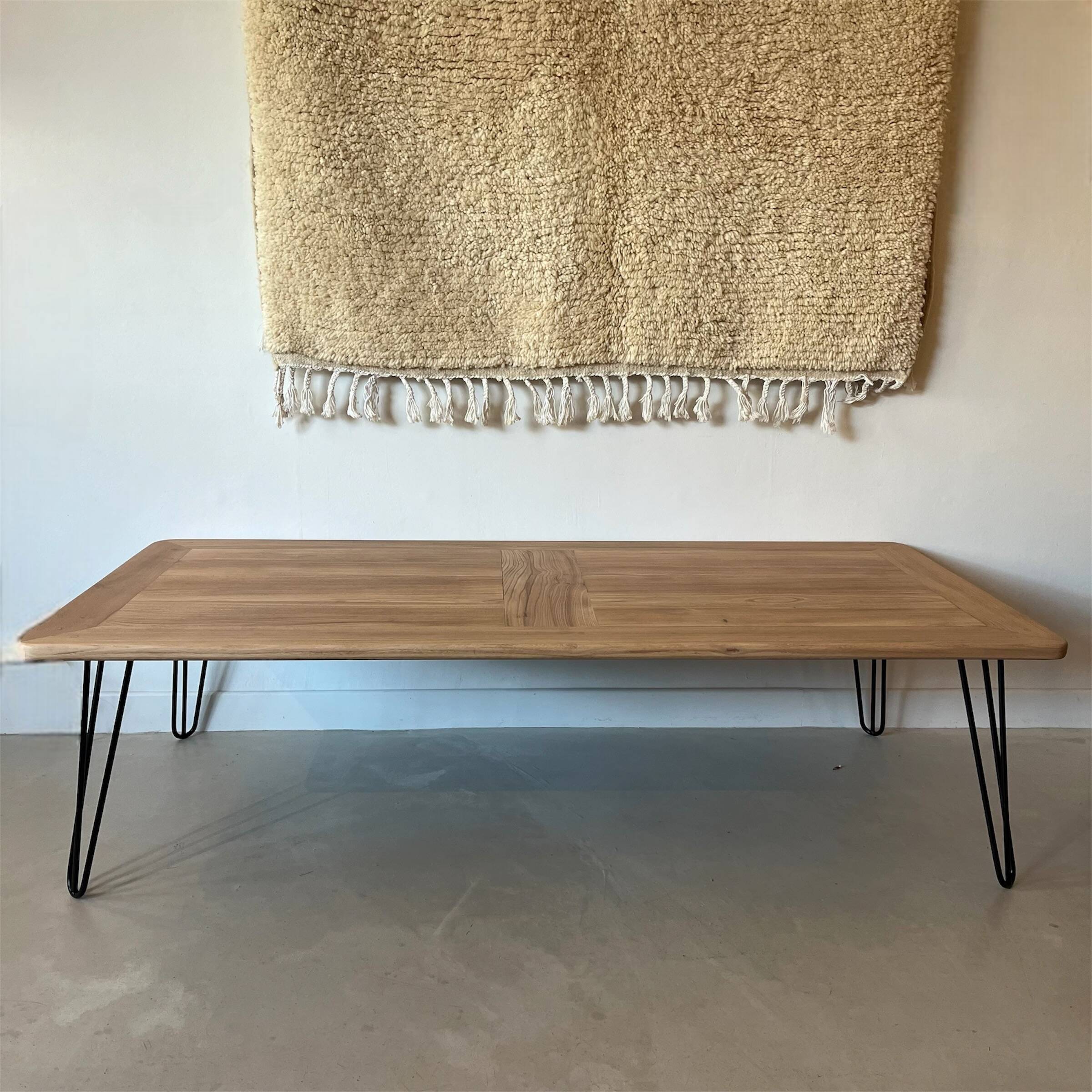 Wooden coffee table with metal legs