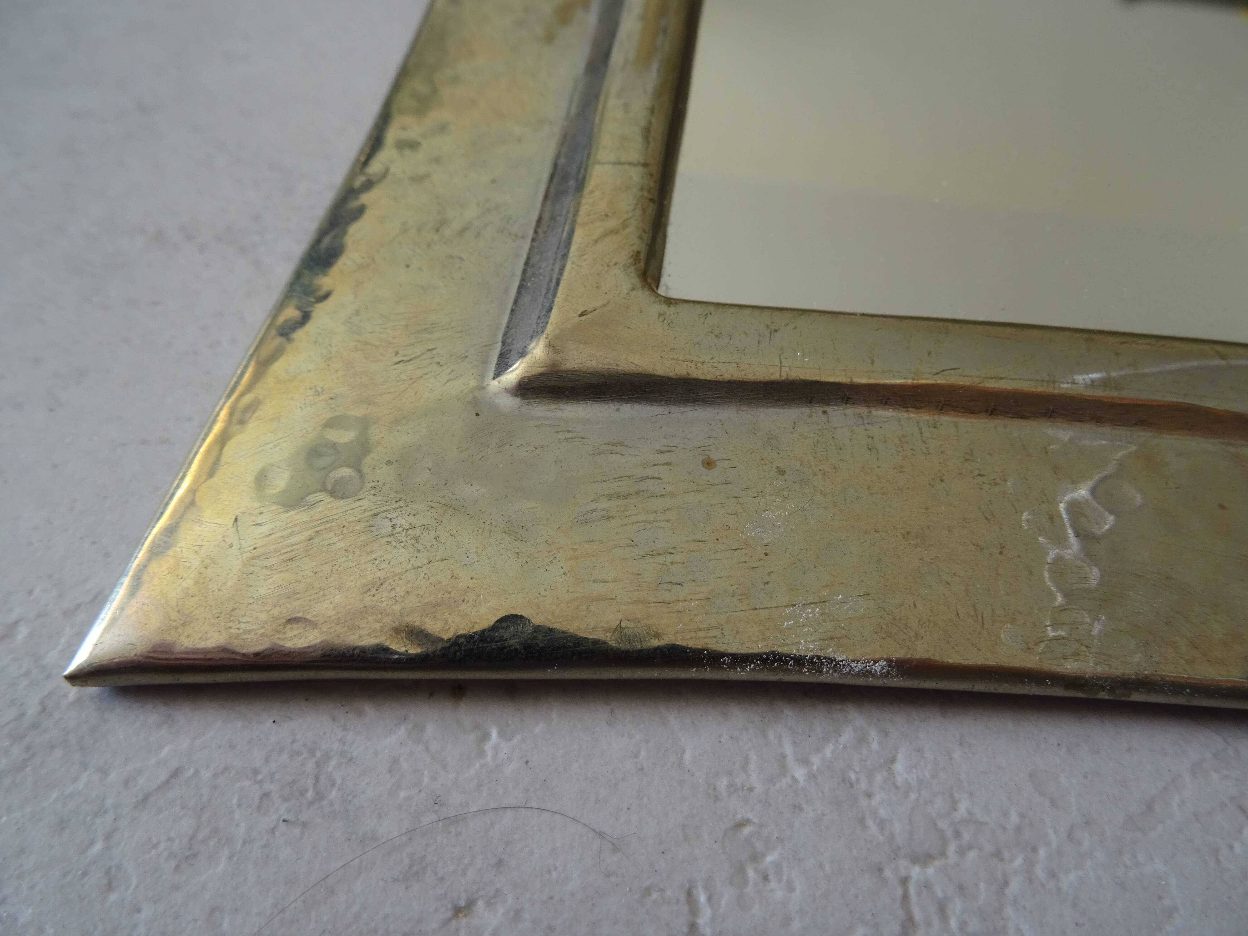 Hammered metal mirror design