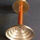 Two vintage wooden and brass candlesticks.
