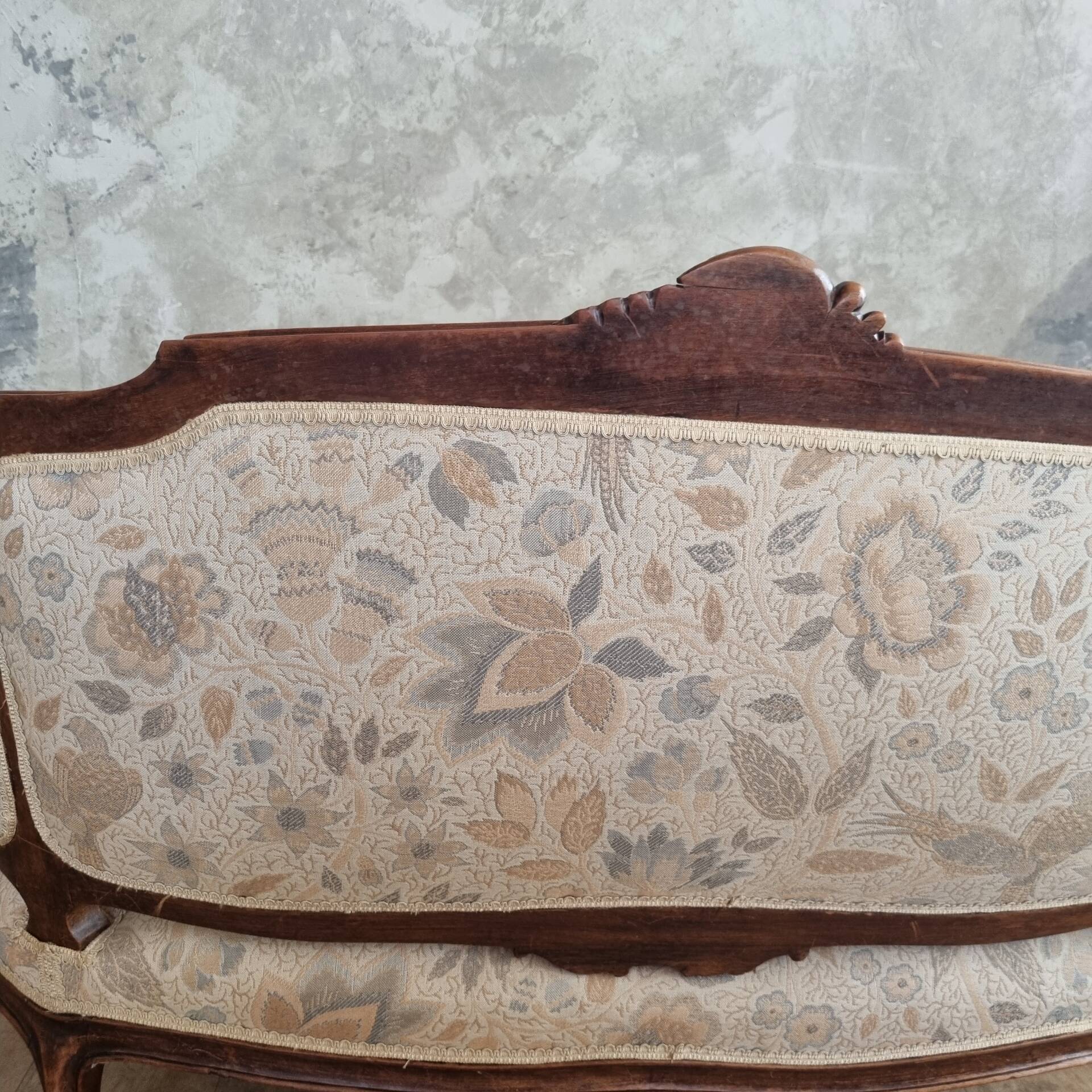 Small sofa or bench in Louis XV style, rococo.