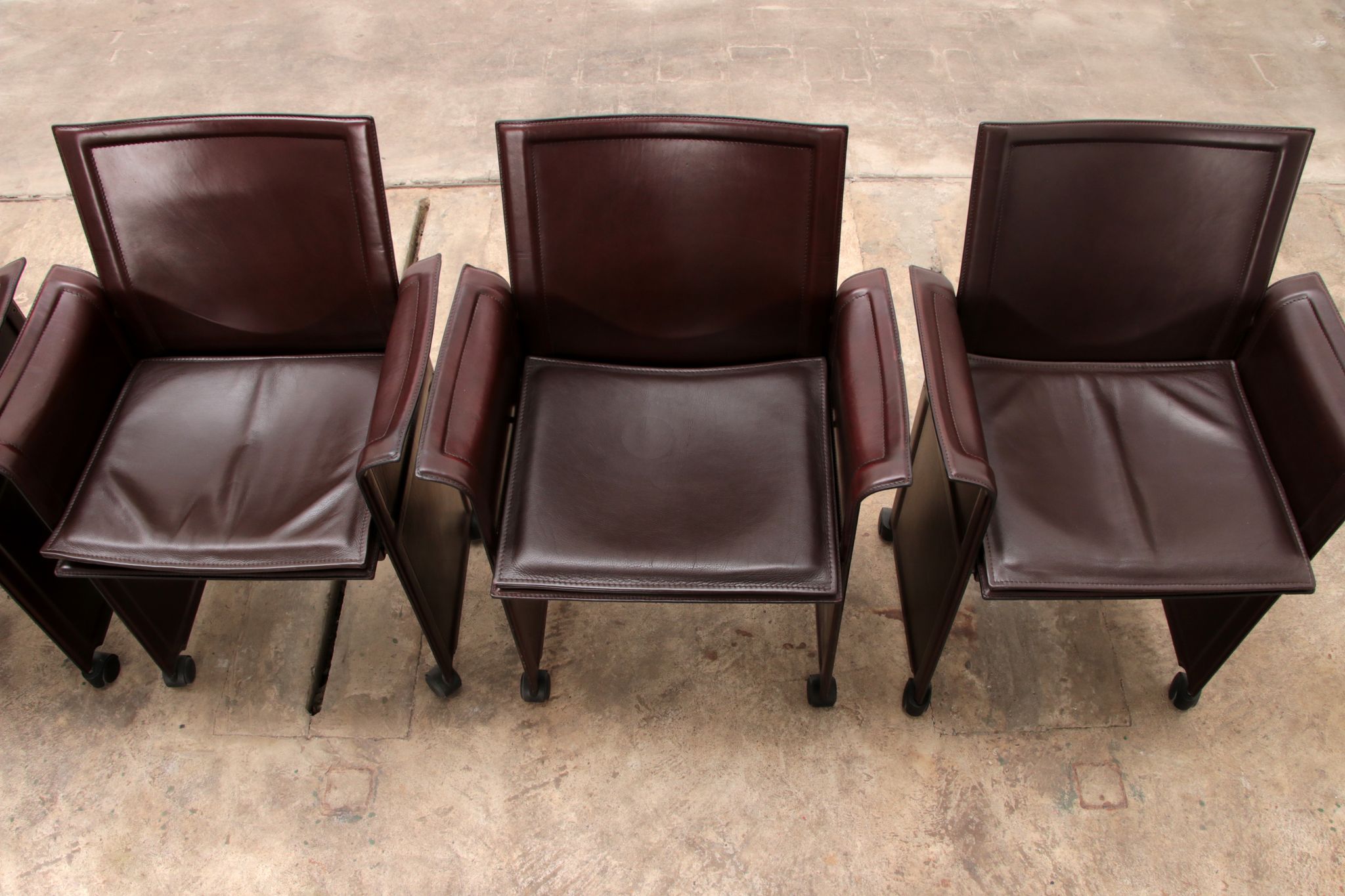 Tito Agnoli for Matteo Grassi leather dining table and six chairs