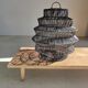 Braided rattan suspension in the shape of a black accordion