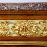 Empire style chest of drawers in lacquer, bronze and marble. Nineteenth century.