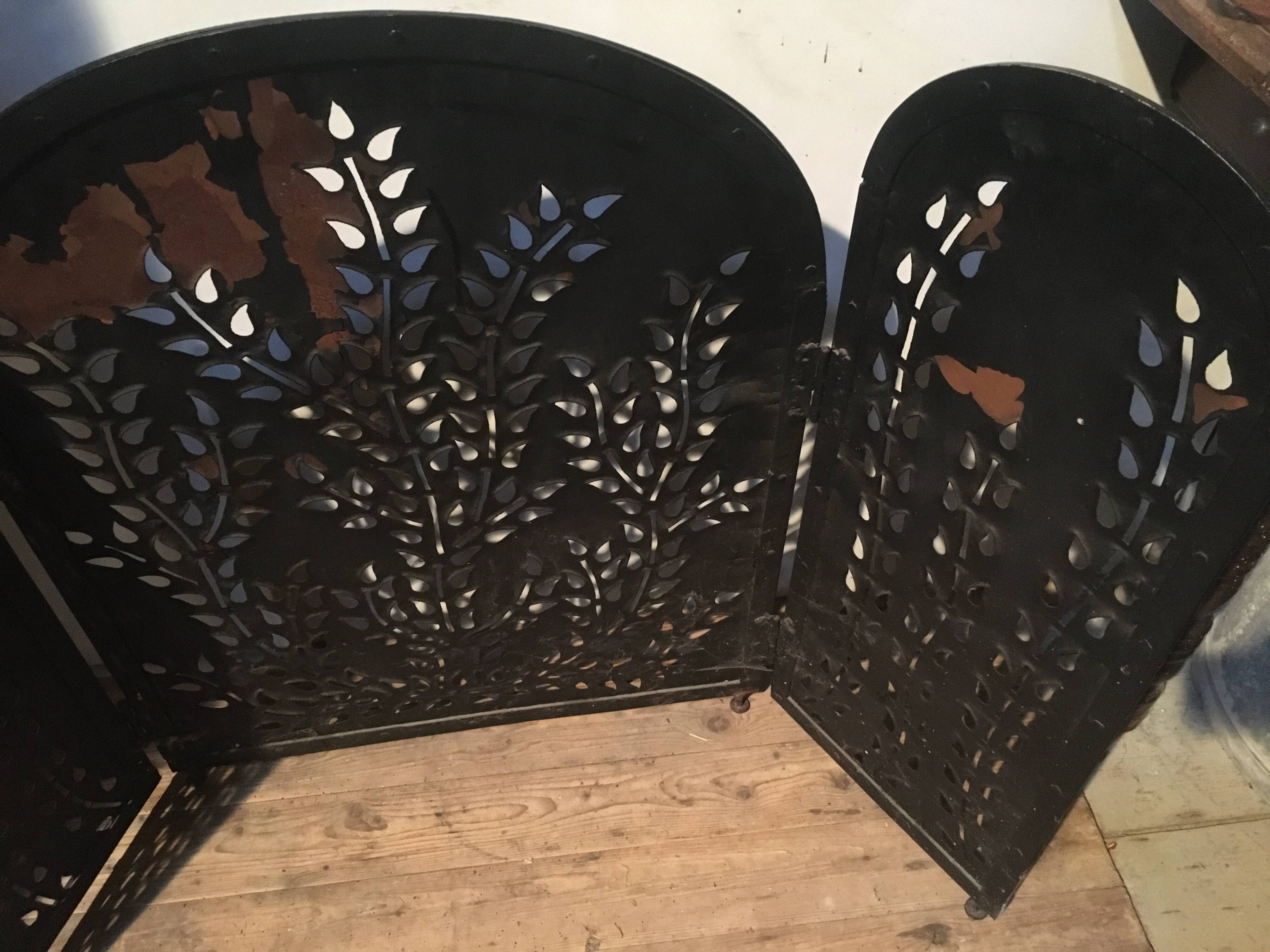 Wrought and cut metal fire screen
