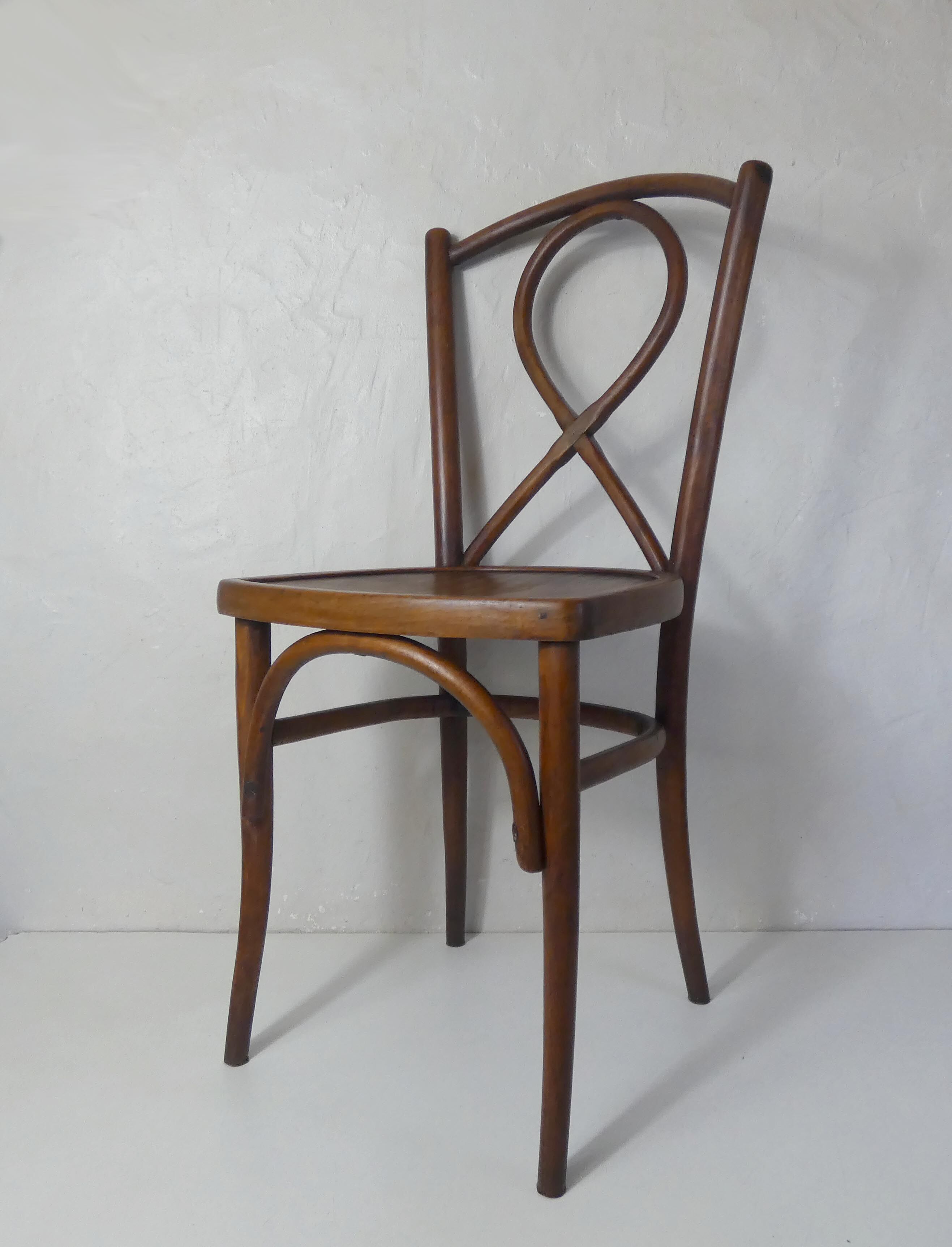 Old curved wooden bistro chair