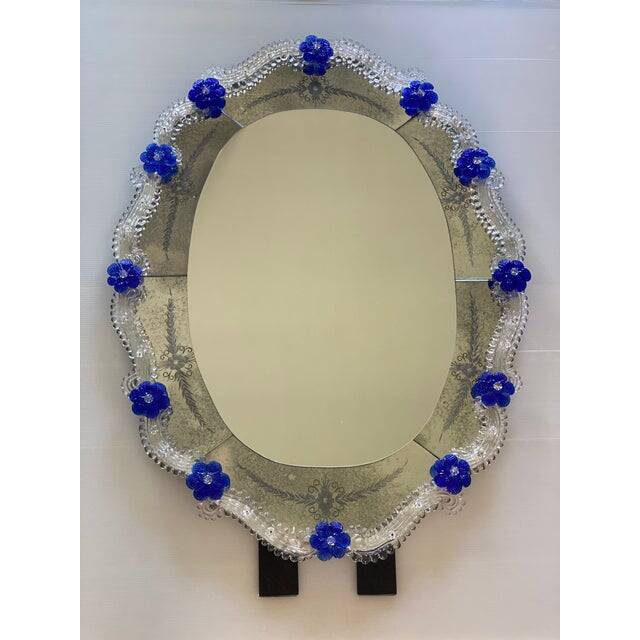 Early 21st century venetian oval floreal hand-carving mirror in murano glass