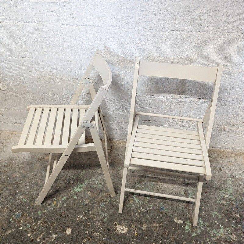 Pair of white wooden folding chairs