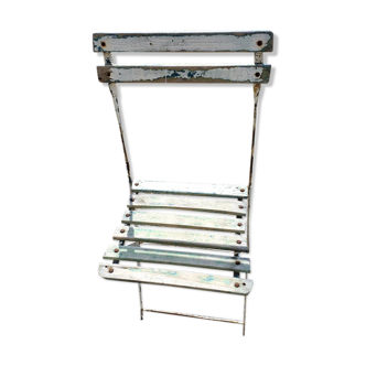 Wooden slatted garden chair with wooden slats and iron foot