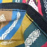 Traditional Berber tribal kilim rug with multicoloured geometric patterns.