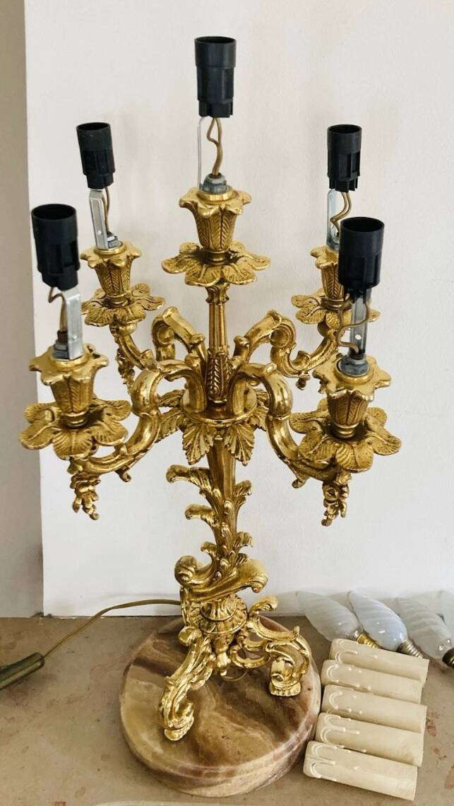 Pair of gilt bronze chandeliers, marble bases.