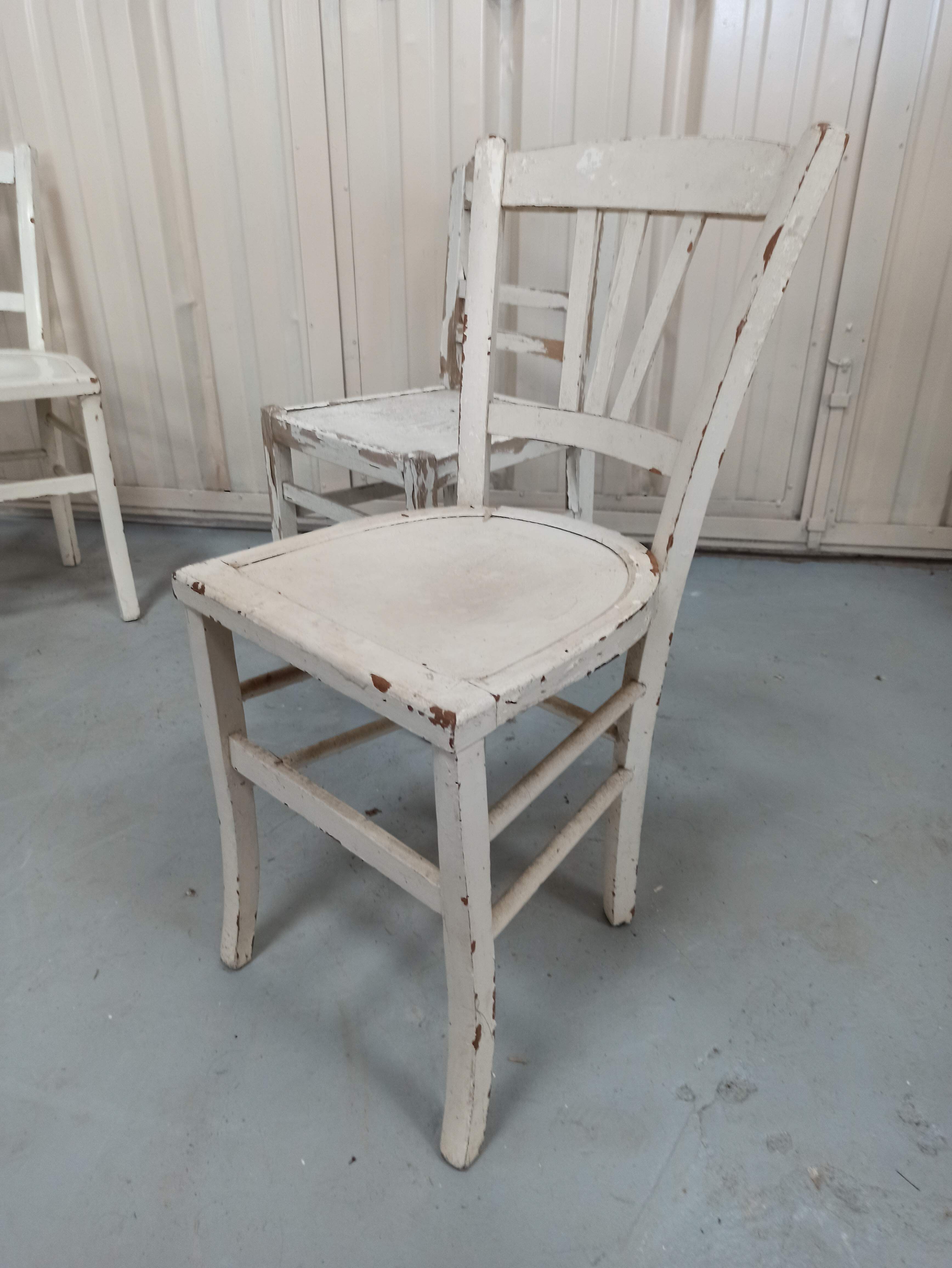4 patinated white bistro chairs