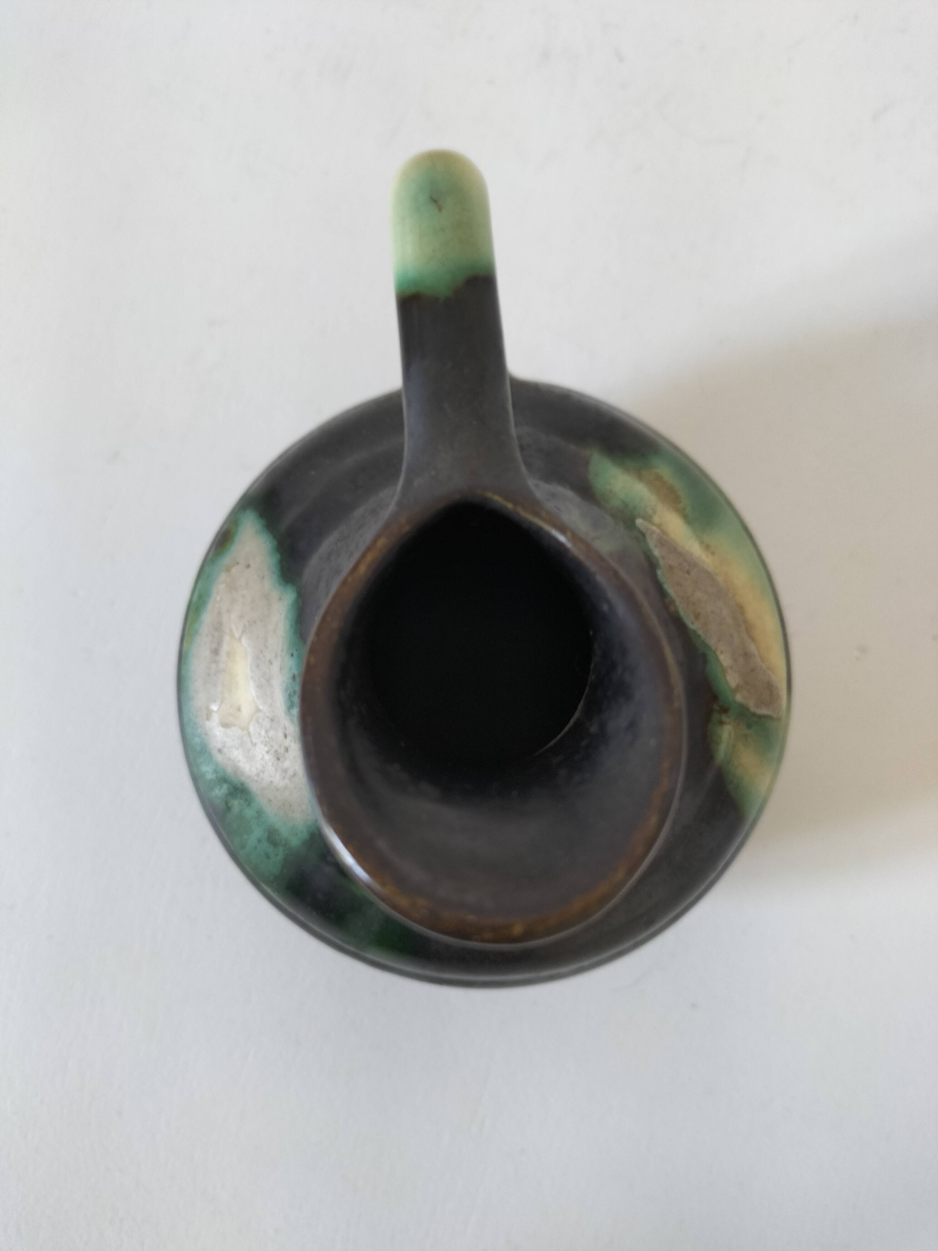 Ceramic pitcher Thulin Belgium flamed green black enamel