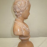 Old bust of a child in platre