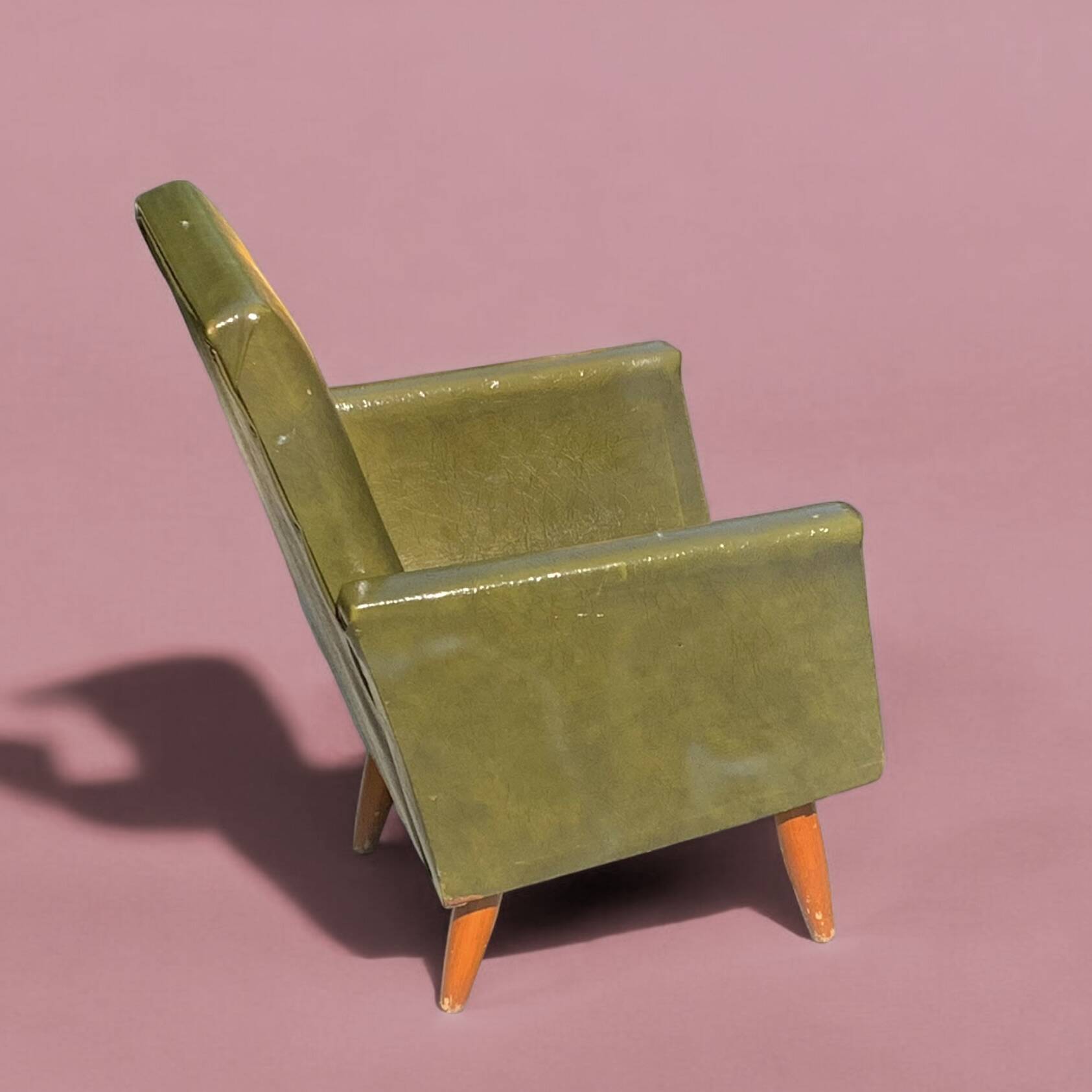 Vintage children's armchair in green skai